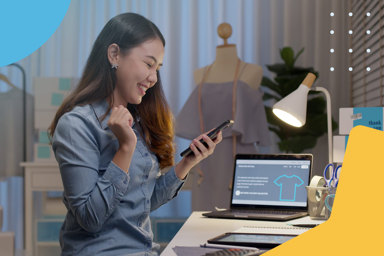 Fashion designer using phone in studio