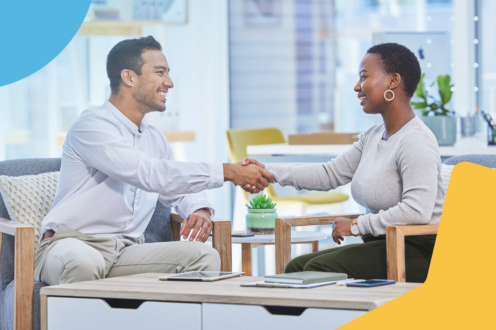 Business people shaking hands indoors