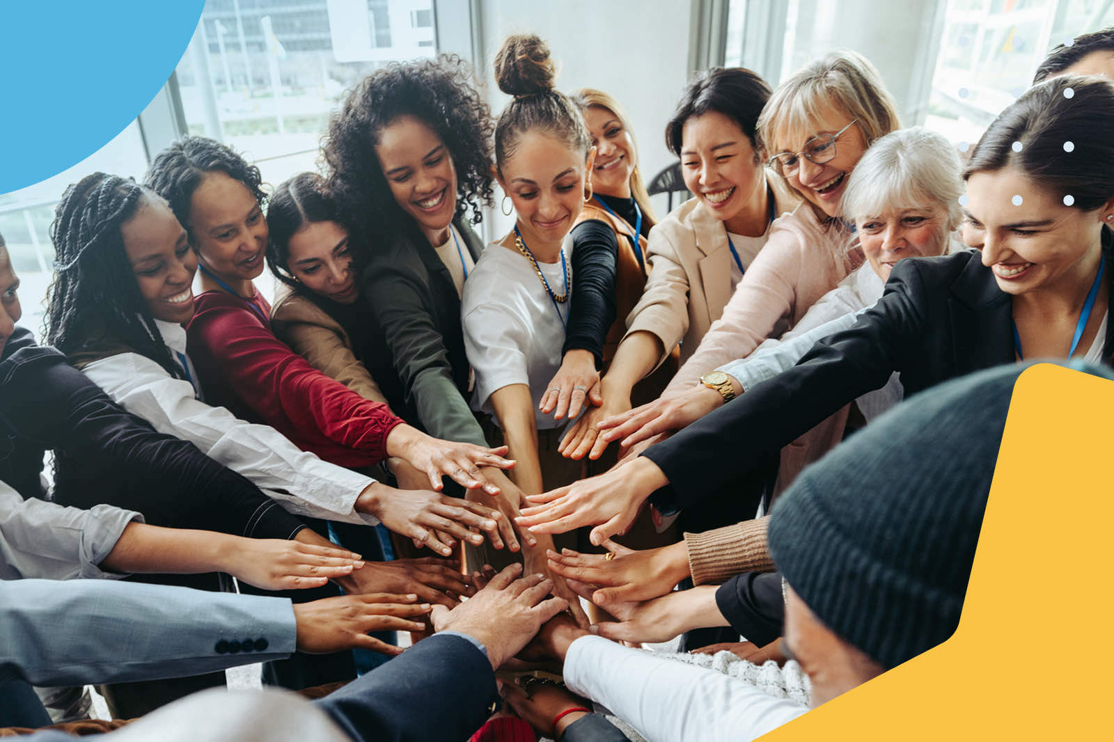 Diverse team joining hands together