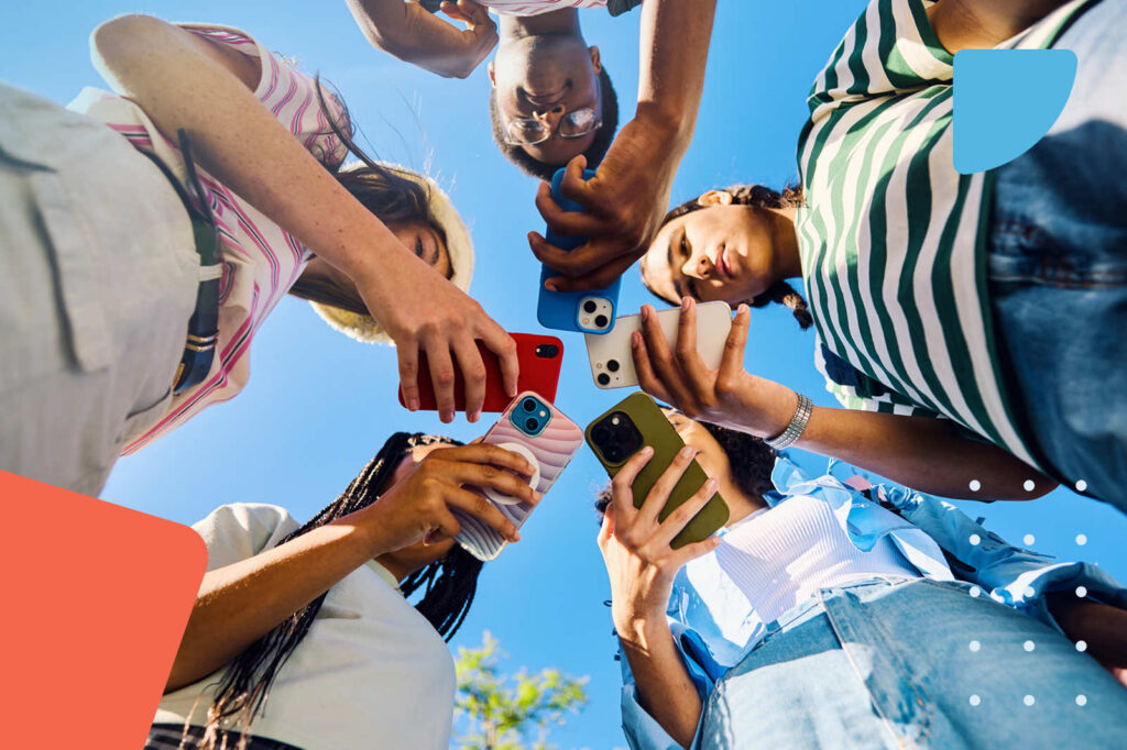 Friends looking down at phones