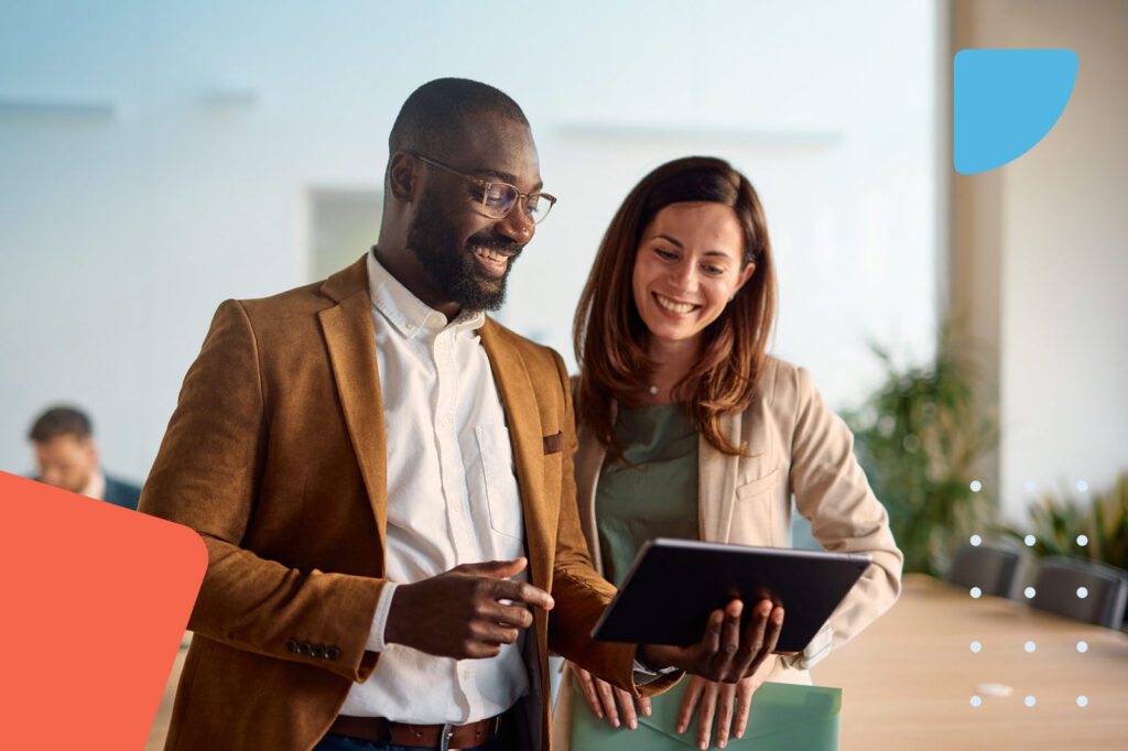 Professionals discussing work on tablet
