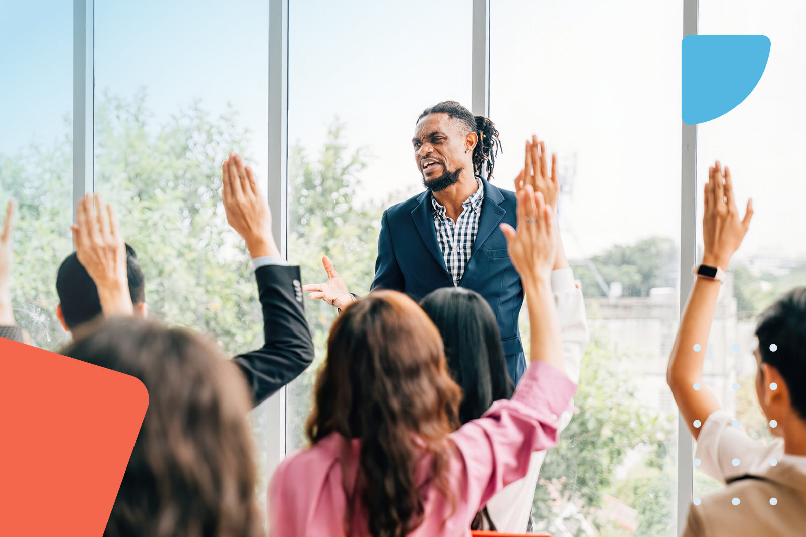 People raising hands during workshop