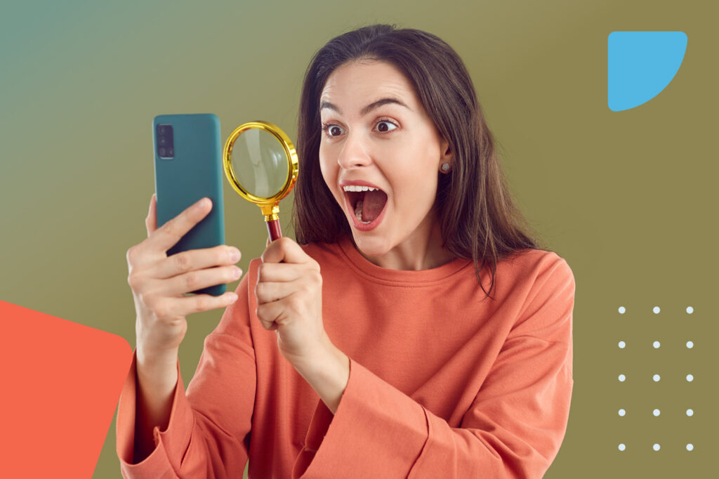 Surprised woman with magnifying glass
