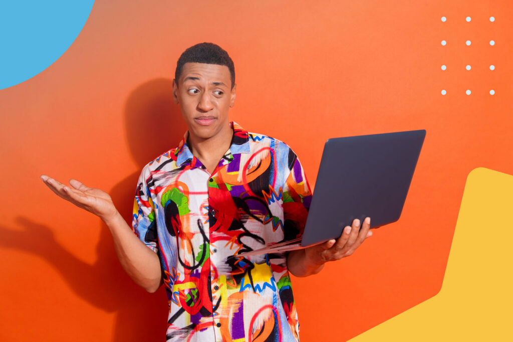 Man looking confused at laptop