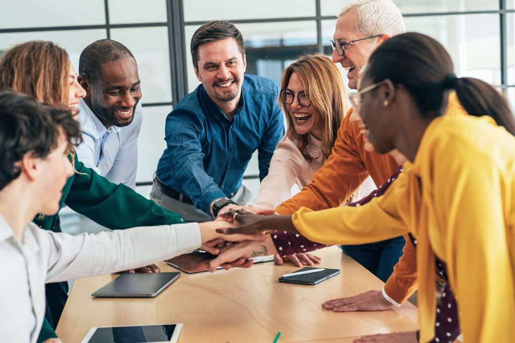 Coworkers joining hands in circle
