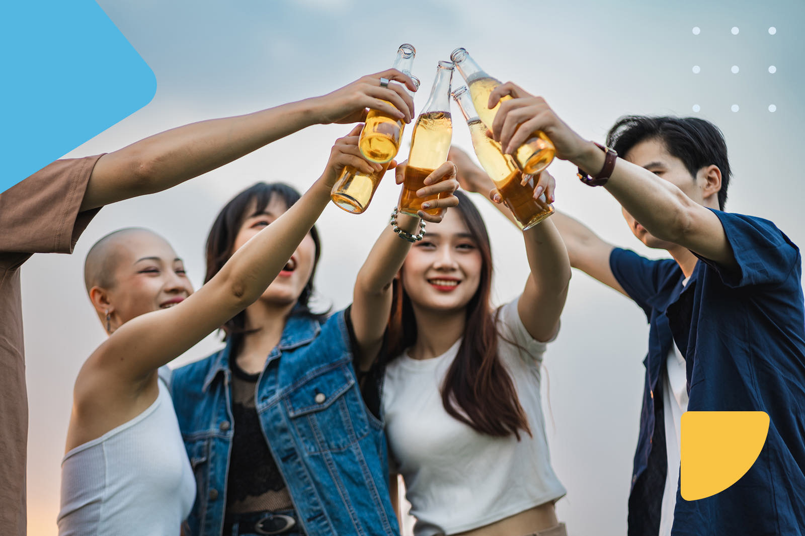 Friends toasting with beer bottles