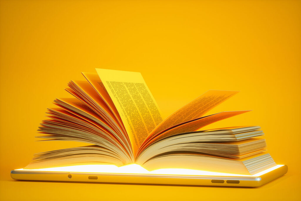 Glowing book on digital tablet.