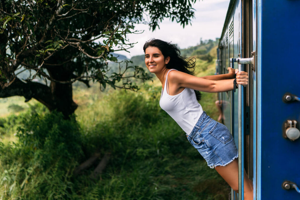 Woman leaning out train window