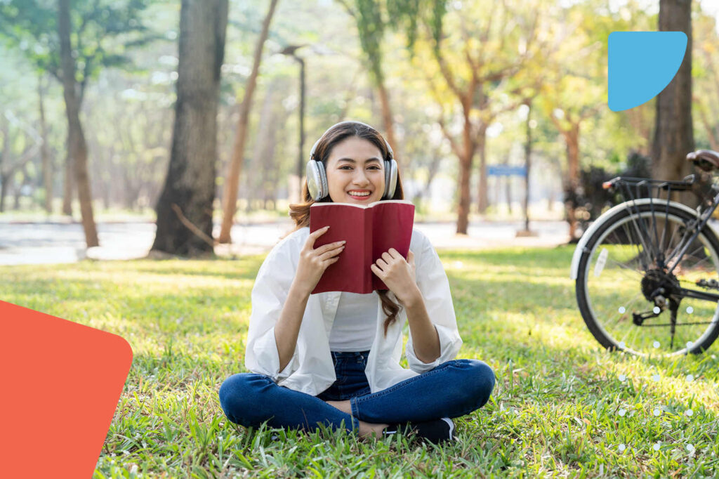 Woman reading book in park