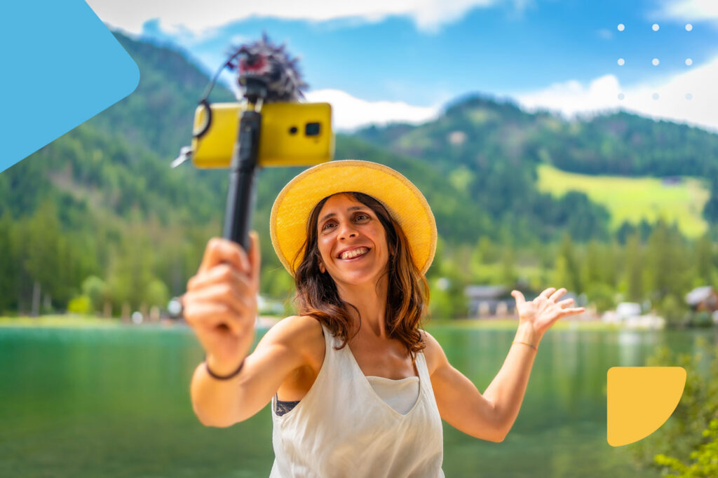 Woman vlogging by a lake