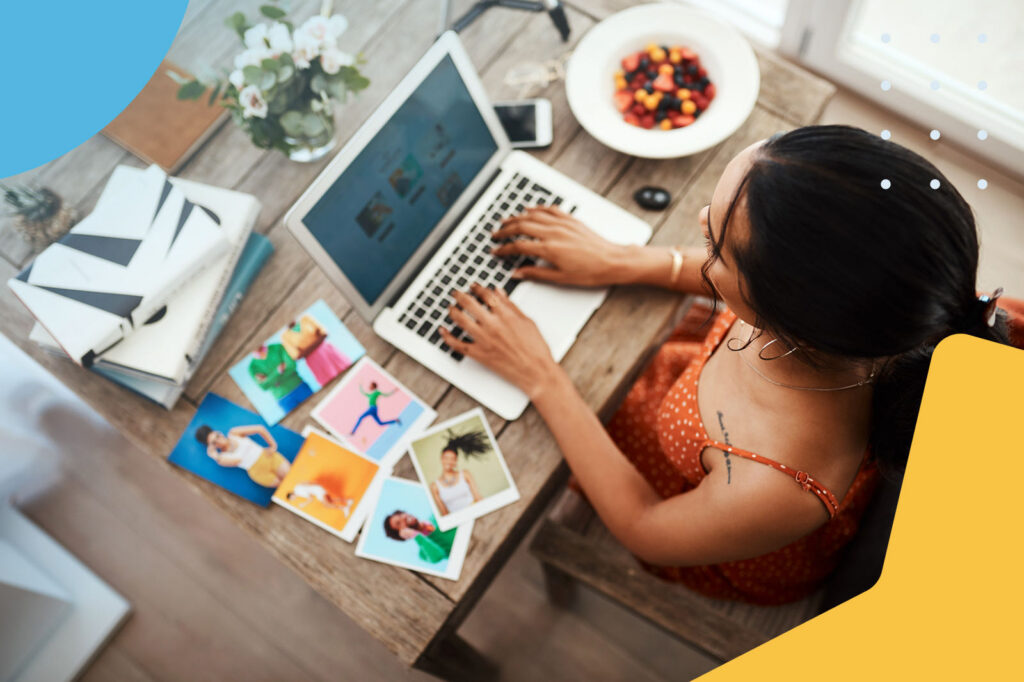 Creative professional organizing photo prints at a desk