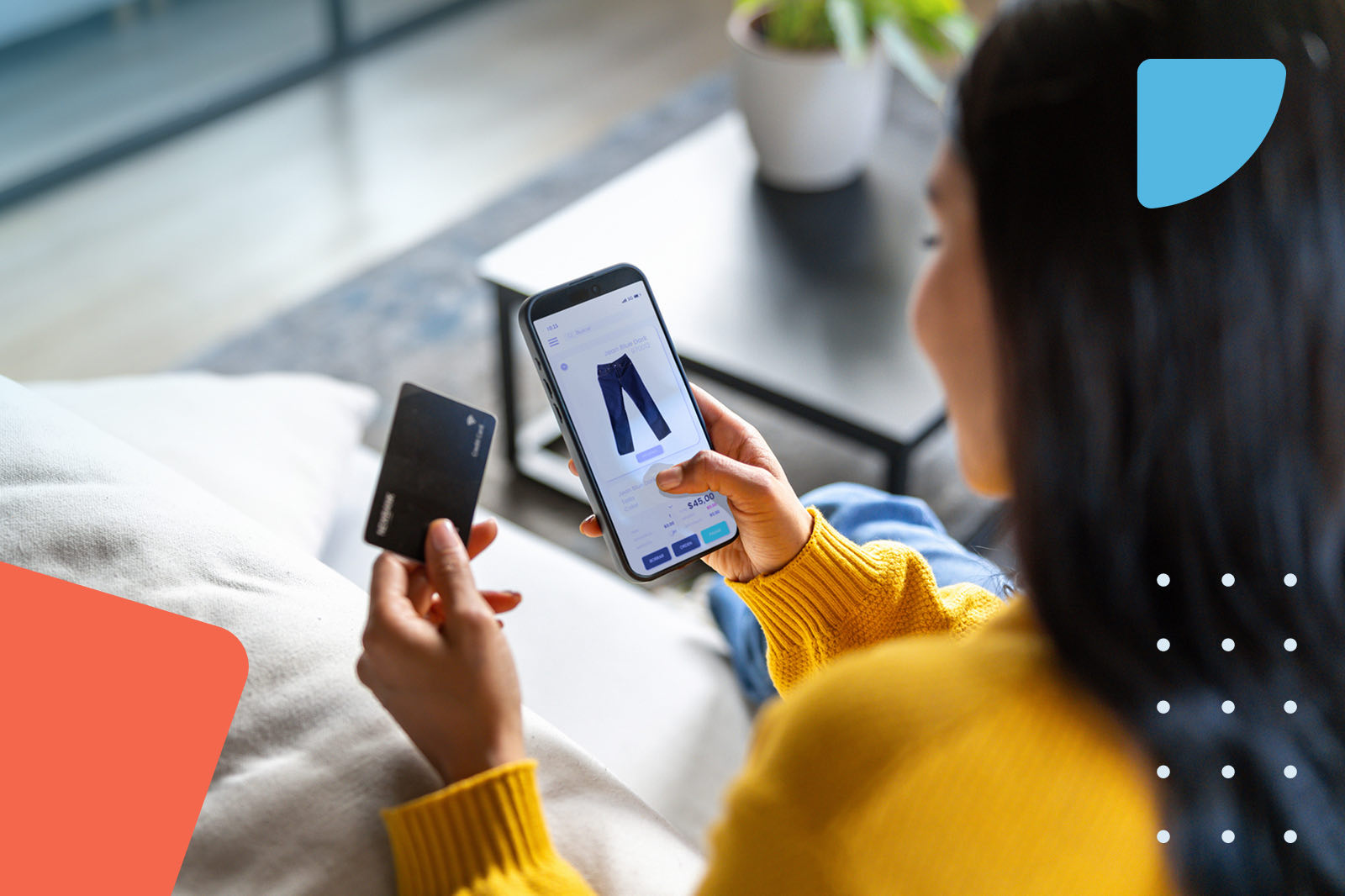 Woman shopping for clothes on a mobile app with a credit card