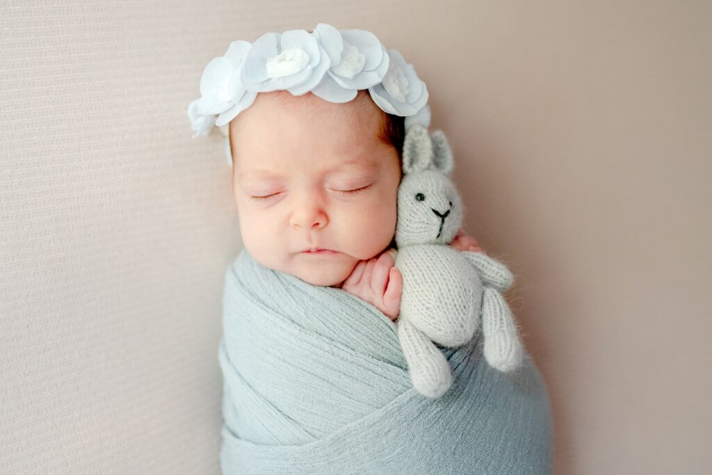 Baby with a doll