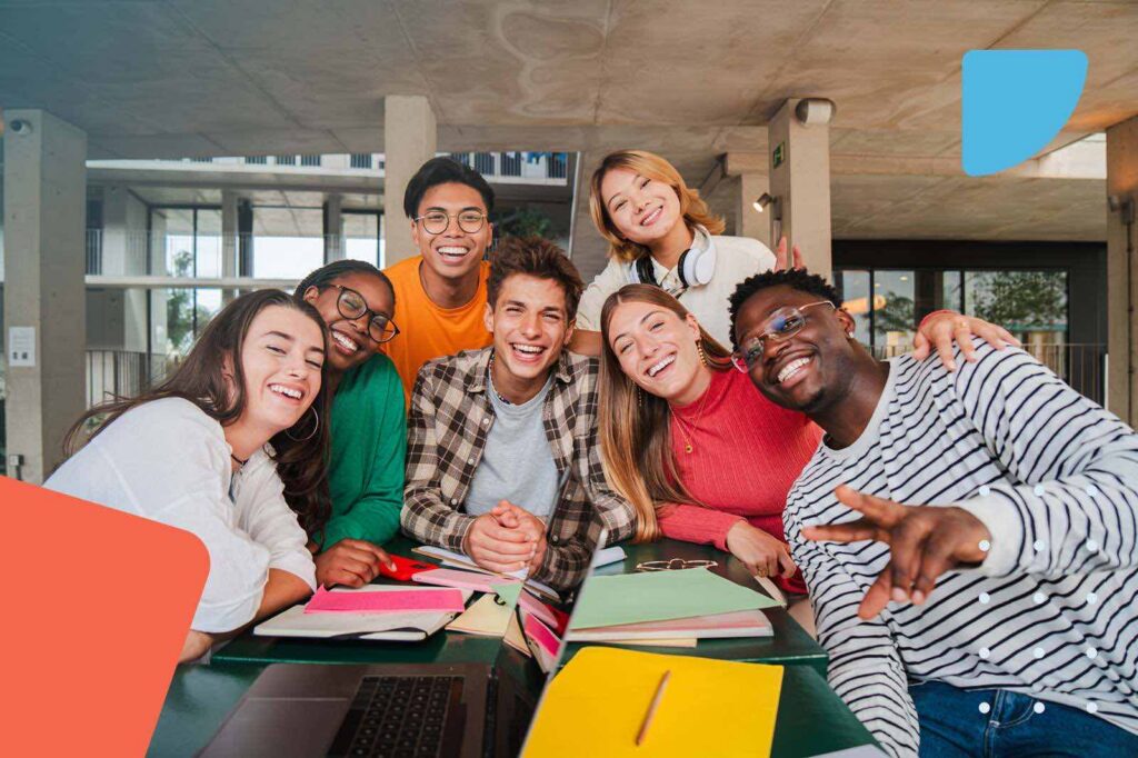 Happy young college students smiling and looking at camera