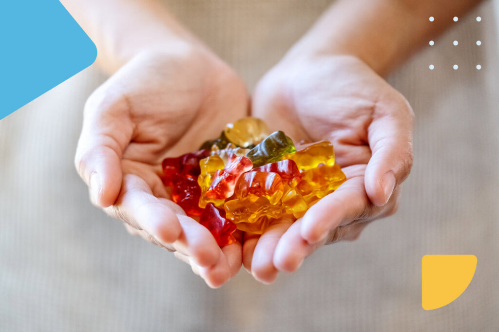 Hands holding colorful gummy bears