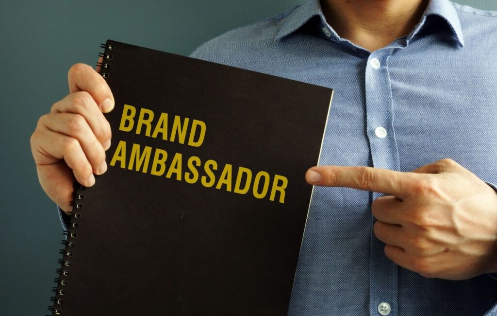 Brand ambassador book held by man