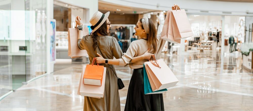 Two friends shopping at mall
