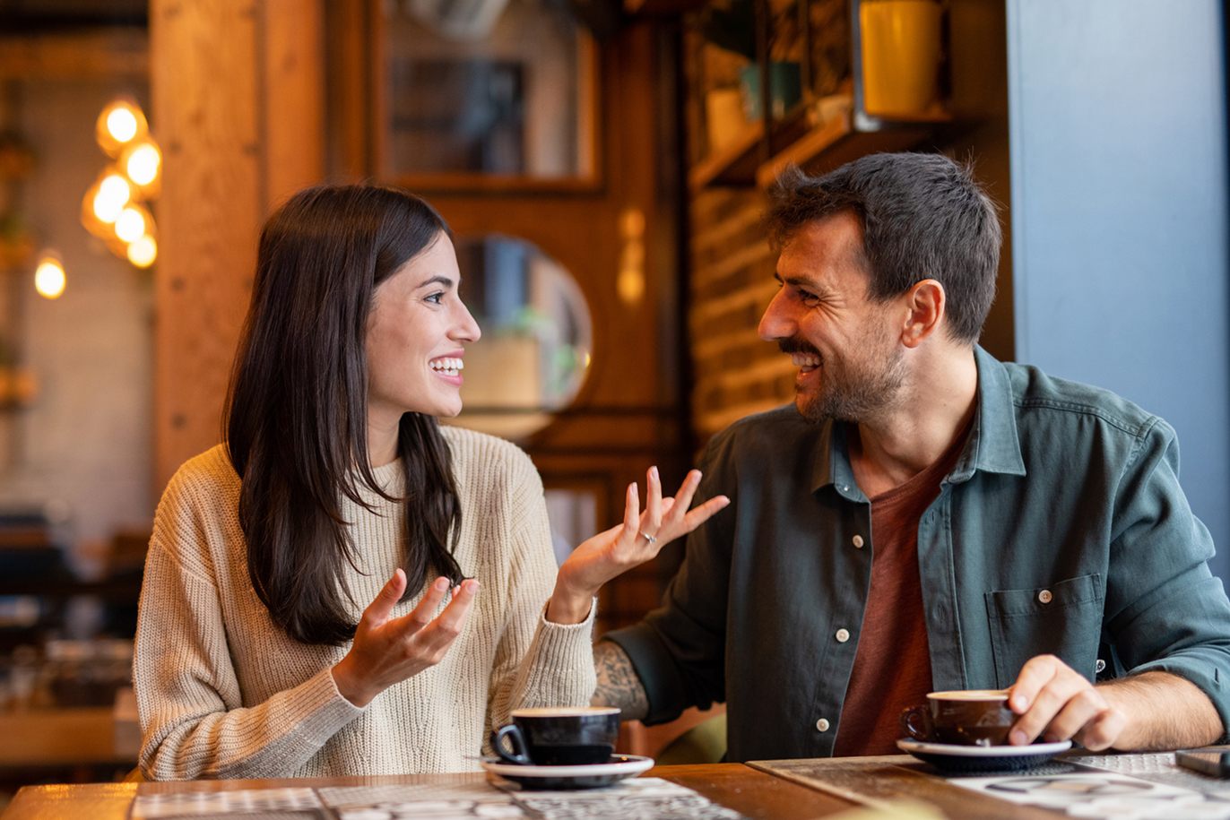 Men and women having a conversation