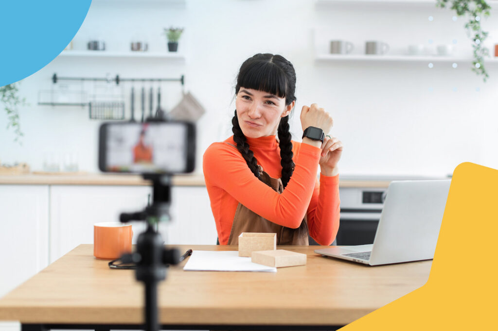 Woman recording a video review of a smartwatch