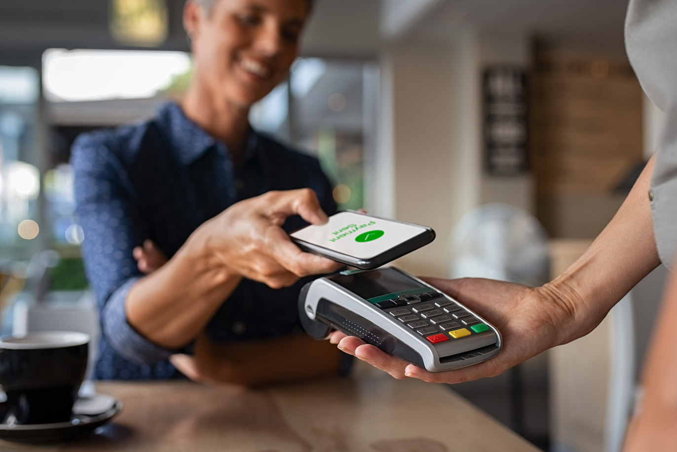 Customer using a smartphone for contactless payment