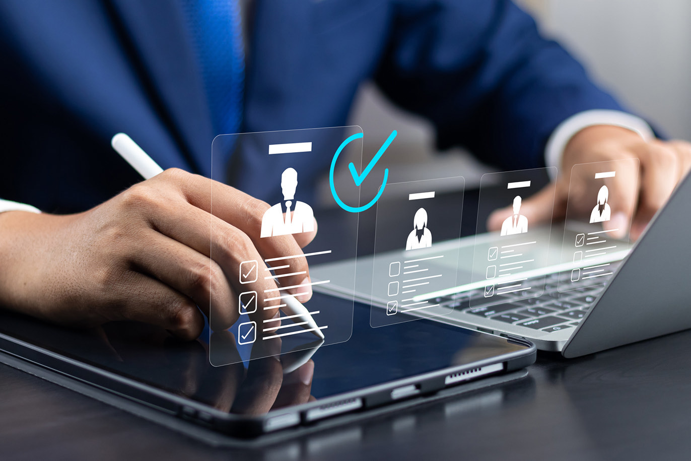 Businessman using a tablet and stylus for digital HR recruitment