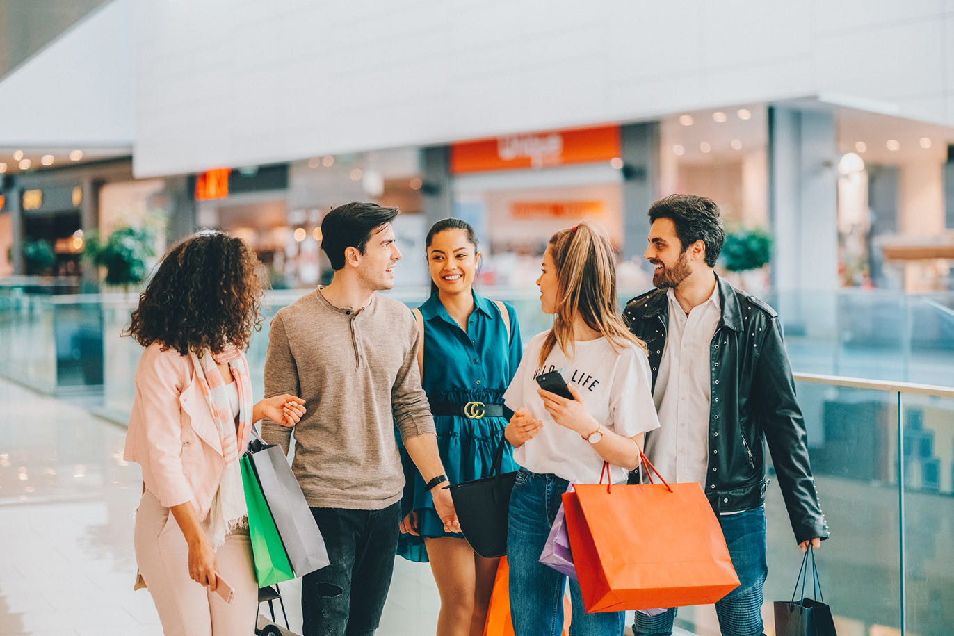 Diverse group of friends shopping at a mall