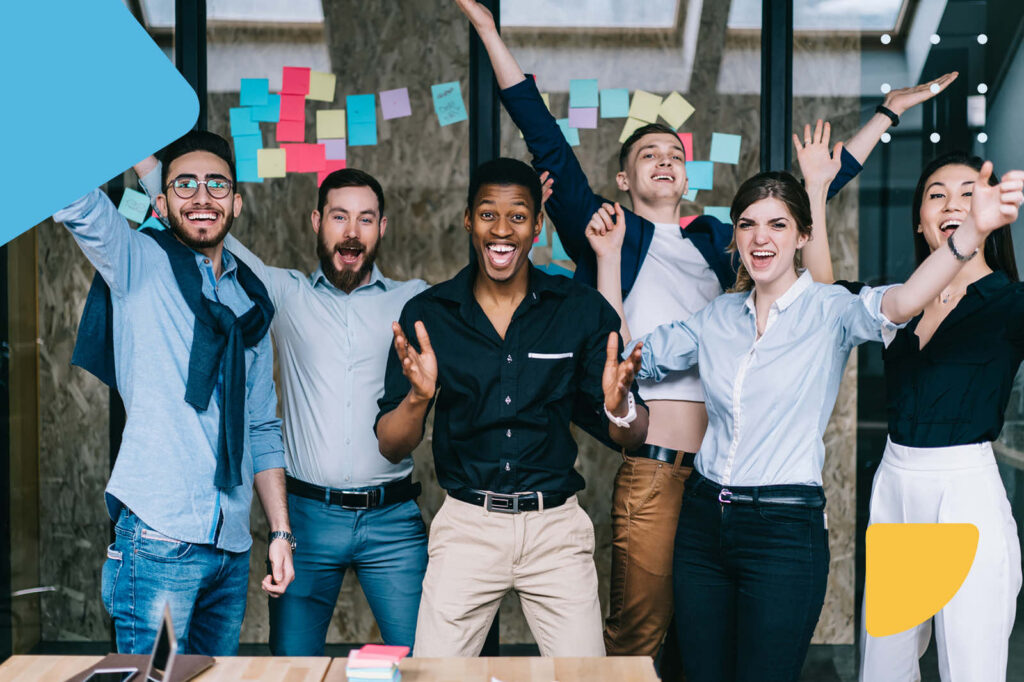 Diverse team celebrating success in an office