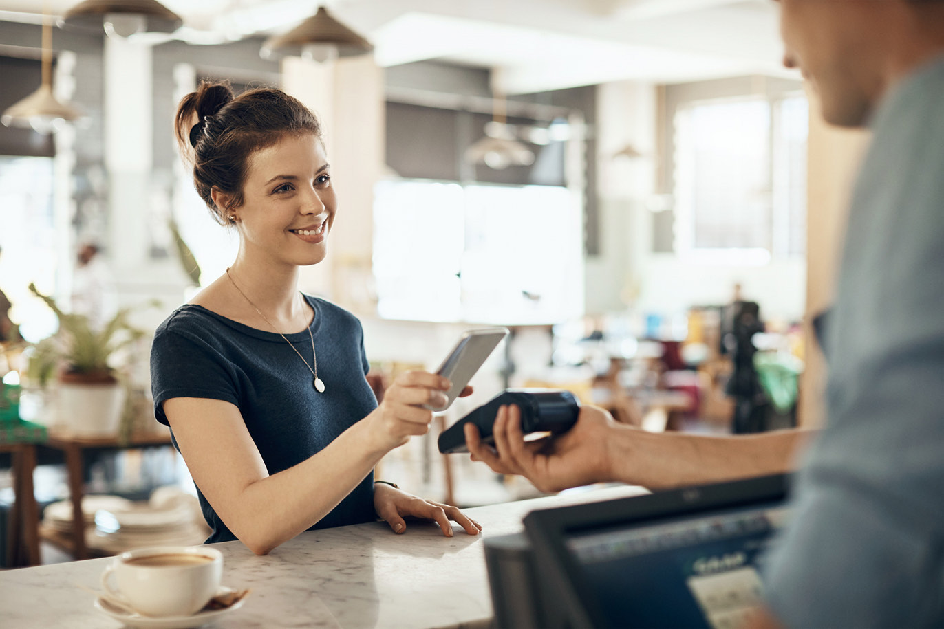 Woman paying with a phone