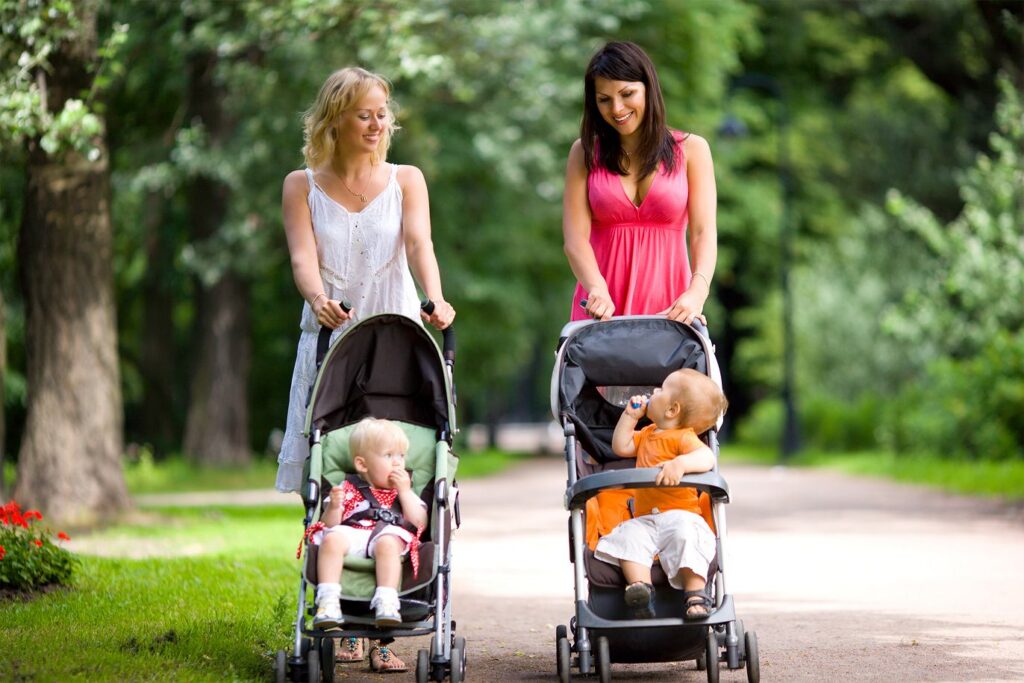 Two women with strollers