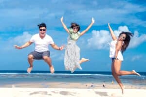 Ambassadors jumping on the beach