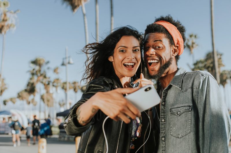 Cheerful ambassadors taking a selfie