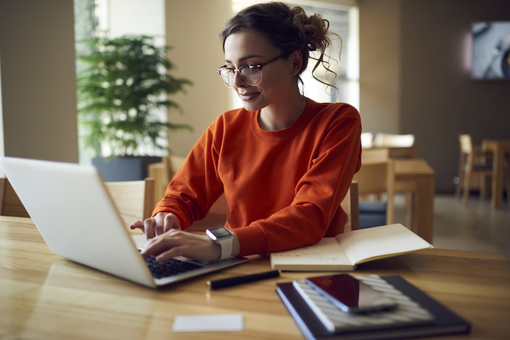 Woman typing on laptop