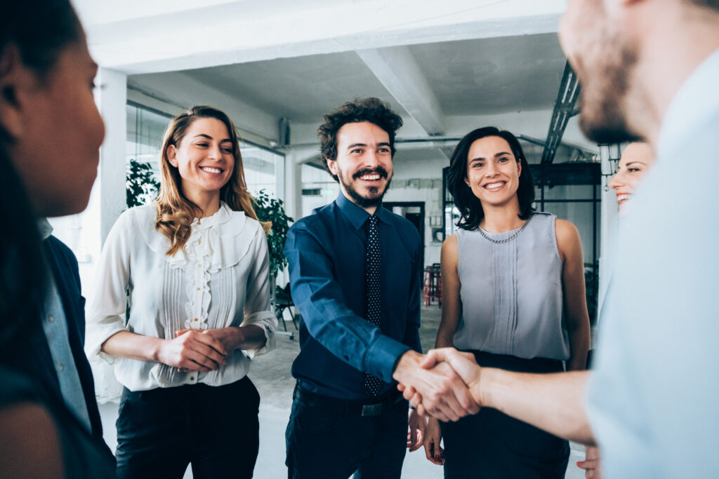 A group of business people shaking hands