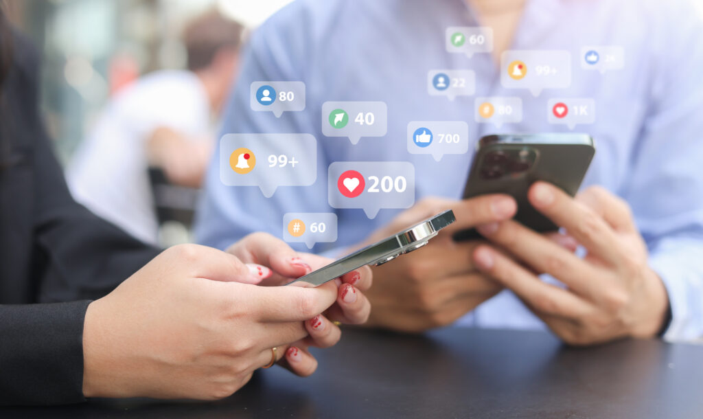 close up young woman and man use smartphone to check feed and notification on social media network application with virtual icon for modern and technology lifestyle concept