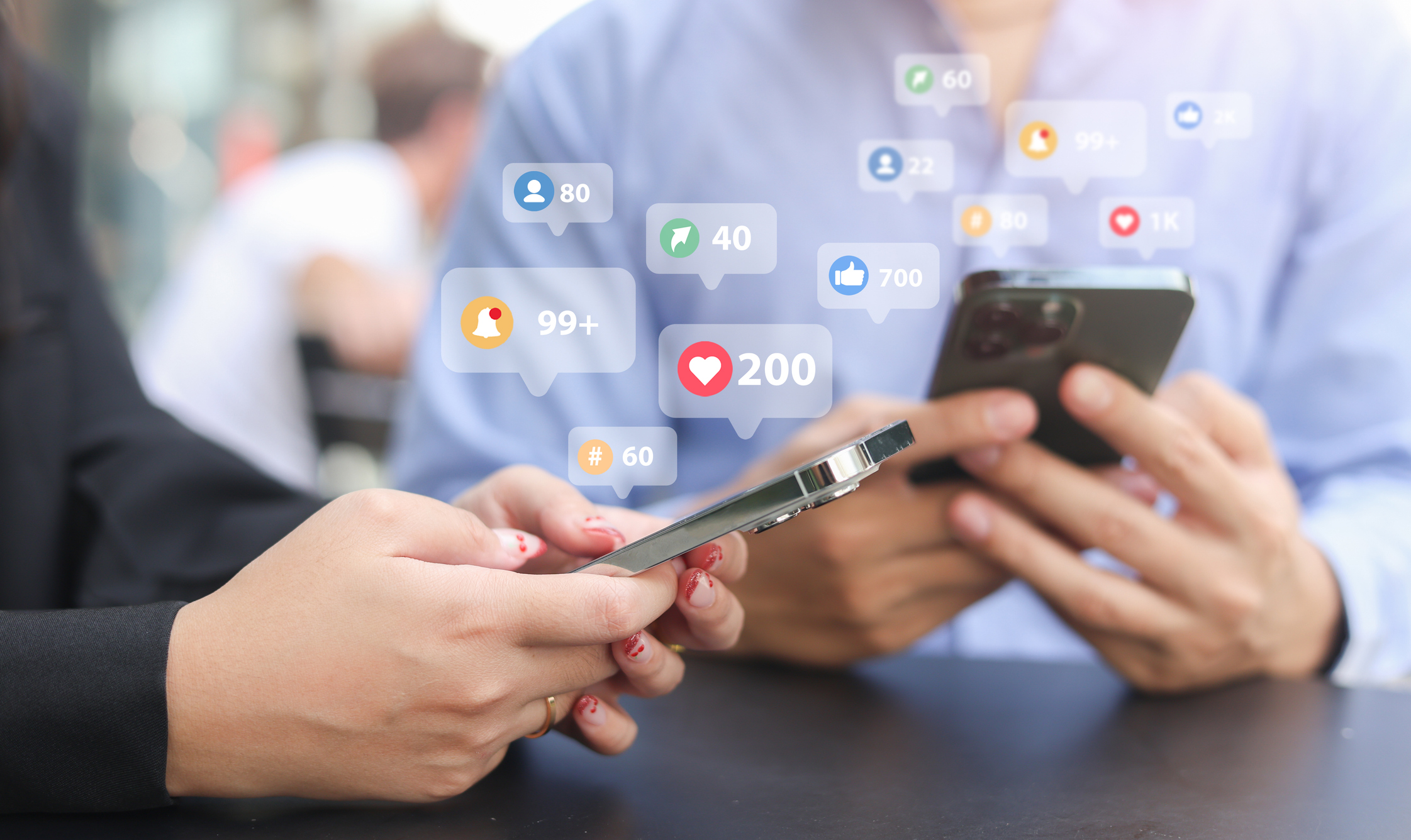 close up young woman and man use smartphone to check feed and notification on social media network application with virtual icon for modern and technology lifestyle concept
