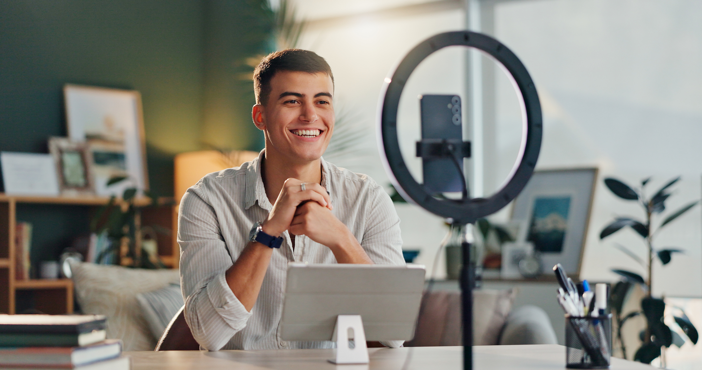 Man, influencer and home with smartphone for social media or online media after successful ambassador incentives.