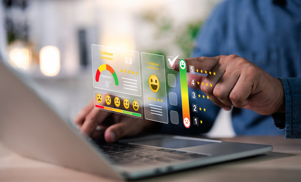 Person selecting a satisfaction rating on a laptop with review and rating panels overlaid, reflecting the tracking software needs to manage influencer tiers 